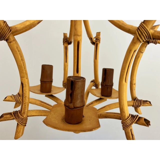 Chic Italian tole bamboo pagoda chandelier in its original matte mustard yellow finish with lifelike bent arms, brown...