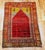 This beautiful Turkish area rug in a prayer rug patten features a magnificent abrash red color in the central field, a...