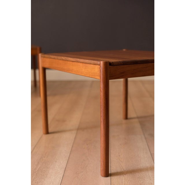 Mid century modern matching pair of side tables manufactured by Magnus Olesen, Durup circa 1960's. Features solid planked...