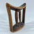 Ethiopian headrests come in various forms. They range from simple to elaborately carved artifacts. They have abstract...