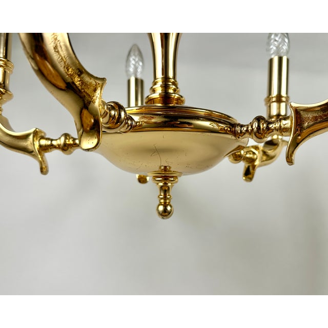 Exquisite pair of vintage chandeliers from Saeval, a renowned Spanish lighting manufacturer. Crafted from rich, golden...