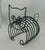 The 1950's Vintage Wire Figural Black Cat Magazine Holder is a unique and stylish piece of metalware that doubles as a...