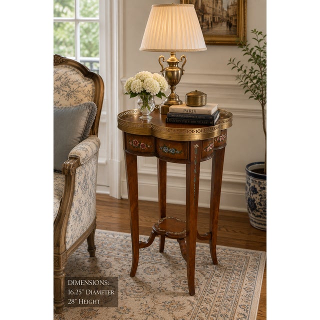 A charming and elegant Theodore Alexander accent table featuring a distinctive quatrefoil form, hand-painted floral...