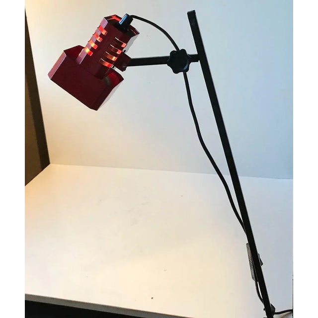 Practical table or shelf lamp. The shade is fully adjustable in all directions. Manufactured by Flipper in Denmark during...