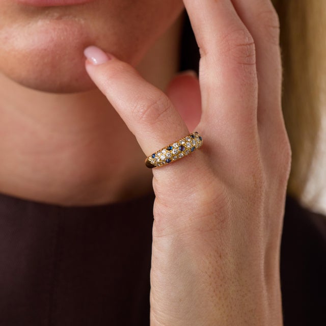 This elegant vintage sapphire and diamond ring is a beautifully detailed 1990’s design, featuring 8 cabochon cut sapphires...