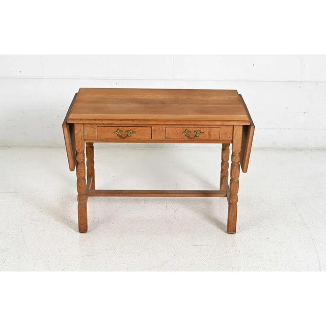 A simple, practical, and flexible Danish modern (circa 1960's) side table in solid wood (oak). The table is solidly build...