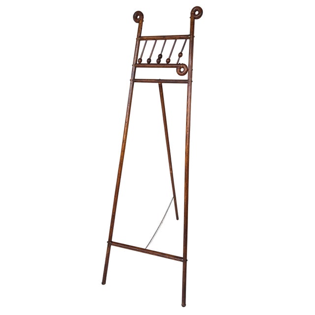 An exceptional large-scale antique floor easel featuring beautifully aged turned wood construction, elegant bobbin...