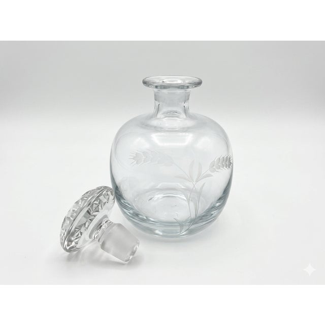 This piece features a beautifully executed etched wheat motif that wraps around the bulbous body, symbolizing abundance...