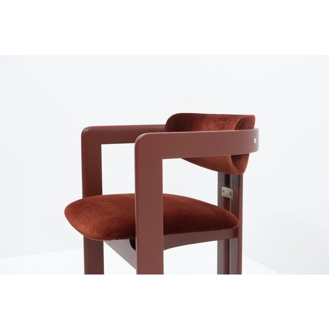 “Pamplona” dining chair by Augusto Savini for Pozzi, featuring a painted wooden frame with velours upholstery. The...