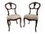 Elegant pair of 19th century chairs in carved solid walnut, inspired by the Louis XV style. Their openwork back features...