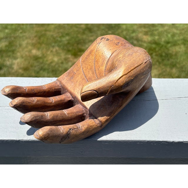 An Open Hand Beautifully executed artisan wood carving of an open human hand and wrist. Incredible detailing - note the...