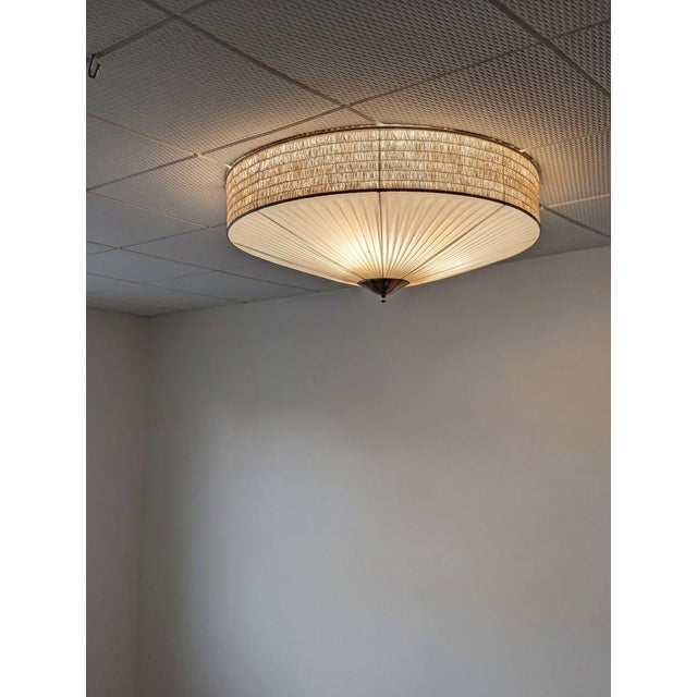An elegant 1950s Finnish flush mount, manufactured by ARIS Oy. This authentic mid-century piece represents timeless...