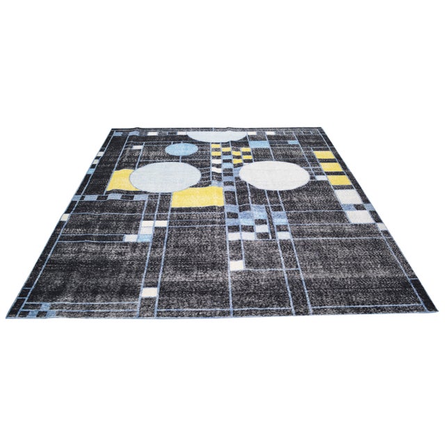 Hand-knotted with care using traditional rug-making techniques, this wool rug blends timeless craftsmanship with a modern...