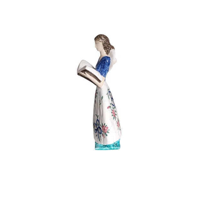 Édouard Cazaux (1889-1974) sculpture "The Reader" in glazed earthenware, dressed in a flowered dress. This piece has an...