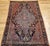 "A striking vintage Persian Farahan area rug, exquisitely woven with a refined botanical composition of exceptional visual...