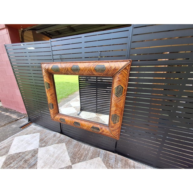 Infuse your interior with a touch of organic luxury with this striking vintage wrapped rattan mirror. This large-scale...