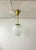 Elegant, middle size rounded pendant in brass and glass produced in sweden. The frosted glass gives a beautiful and soft...
