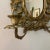 French Rococo Victorian 2 light candelabra sconce in gilt bronze with scrolling silicate arms emanating from a filigree...