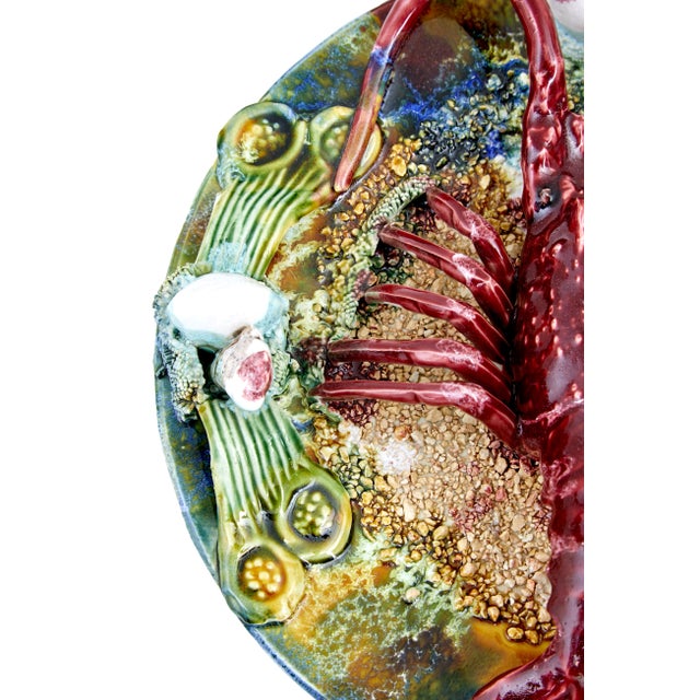 20th century decorative palissy lobster plate circa 1940. 1940’s decorative plate depicting a lobster on the sea bed....