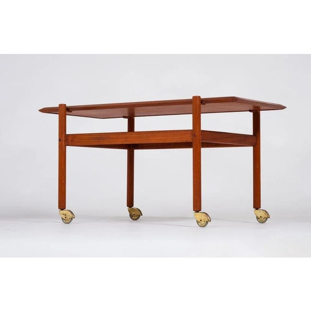 Serving cart in teak with removable top and raised edges. Danish design from the mid 60s. Beautiful cart in good quality,...