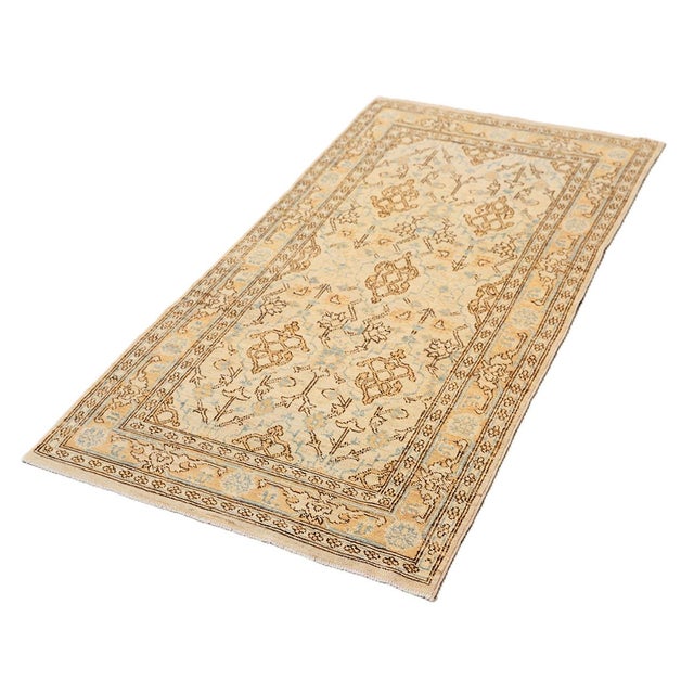 An exquisite accent piece showcasing a classic Persian design, this rug features a pristine ivory background beautifully...
