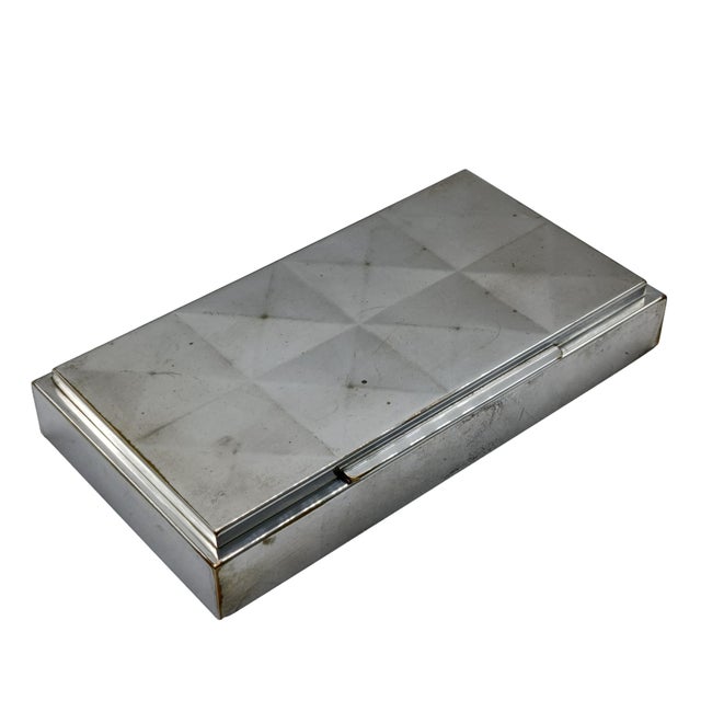 An elegant WMF desk cigarette holder, dating from around 1930, in silver-plated metal, rectangular in shape with a stepped...