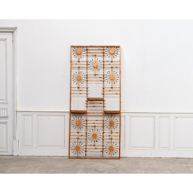 with its iconic 1950s sunburst design, this vintage rattan screen is a truly distinctive piece. Its striking graphic...