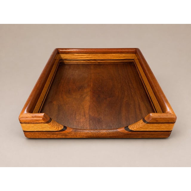 Mid-Century Modern paper and letter tray with streamline design, circa 1970. Comprised of handcrafted teak, maple, and...
