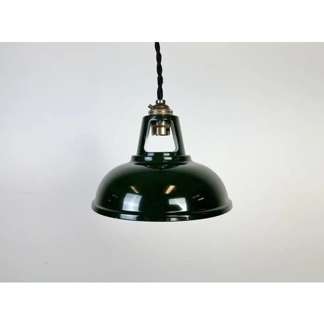 Vintage metal green painted ceiling light in industrial style made in United Kingdom between 2000-2010. The brass socket...