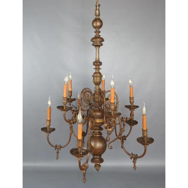 The 19th century dutch ten-arm chandelier is a beautiful example of historical craftsmanship and design. It originally...