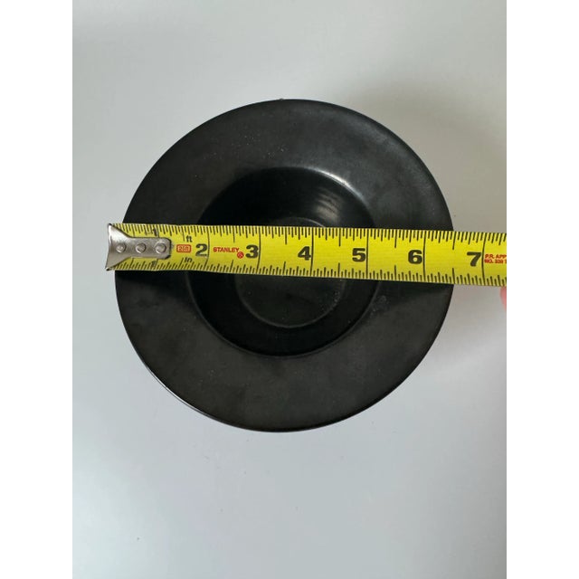 We adore the shape and subtle finish of this bowl. Unfortunately, we can't make out the signature.