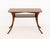 T. H. Robsjohn-Gibbings (British, 1903-1976) for Widdicomb Walnut Table, with two-tiers above saber legs, label to...