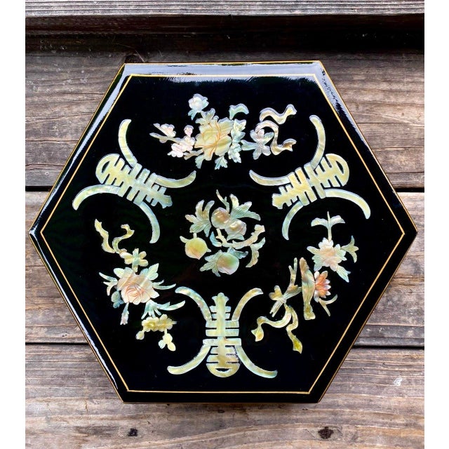 A wonderfully decorative vintage Chinese lacquered serving box, fashioned in a striking hexagonal form and lavishly...