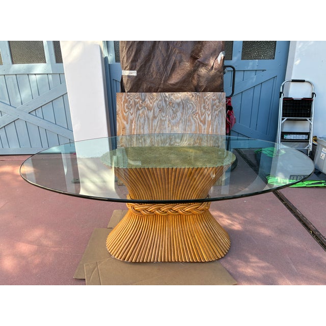 .This is a classic bamboo and glass Mcguire dining set from San Francisco. The oval 3/4 " glass top is 6' x 4' and has a...
