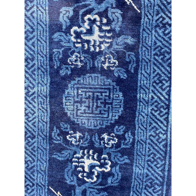 Beautiful late 19th century Chinese rug with beautiful Chinese design and blue field color, entirely hand knotted with...