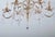 Beautiful chandelier made of patinated metal from the late 1940s. Hand-cut lead crystal trimmings. Functional. Restored...