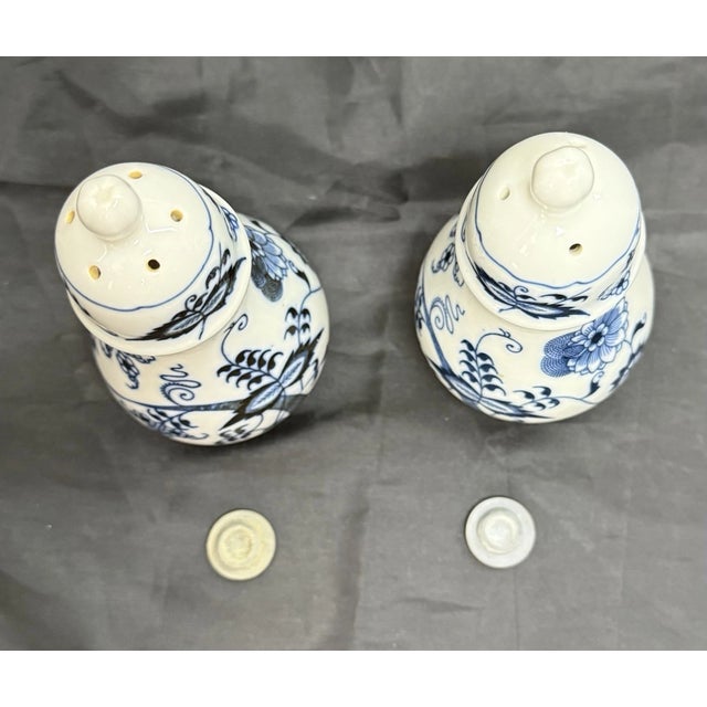 Bring classic European elegance to your table with this charming set of Vintage Blue Danube Salt & Pepper Shakers...