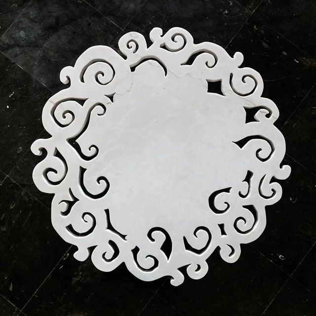 Macrame 'Total is a marble coffee table whose floor represents a tribute to the decorative baroque style present in...