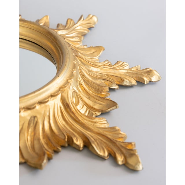 A stunning vintage Mid Century Italian gilded resin sunburst / starburst mirror, circa 1960. Marked "Italy" on reverse....