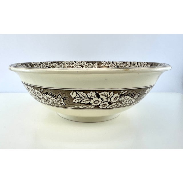 A substantial late-Victorian English transferware serving bowl in the Beatrice pattern by Wedgwood & Co., measuring an...