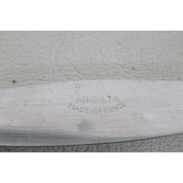 This lovely Dessert / Cheese Knife is made out of metal with a ceramic. The blade is marked as being made in France by...