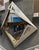 Post-Modern wall-mirror, circa late 20th century. This geometric diamond-shaped mirror features silver and gold accents,...