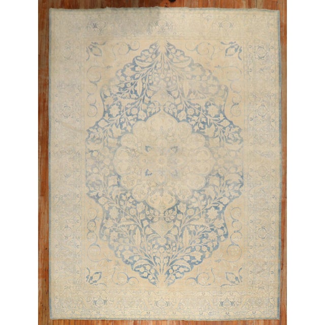 A 2nd quarter of the century Persian Tabriz in blues and gold Measures: 8'2'' x 11'4''.
