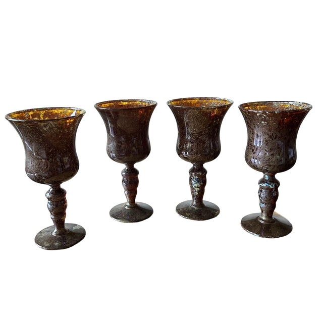 From Modcabana. The lovely art glass wine goblets make a stunning presentation. There are mottled amber, olive tan with...