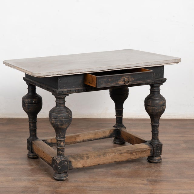Baroque period stone top table from the 19th century, Sweden. This impressive table features a gray stone top with unique...