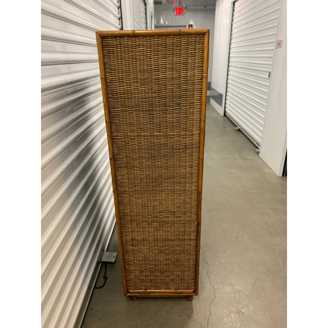 Here we have a fabulous vintage faux bamboo and wicker tallboy dresser. This very versatile piece could also be used as a...