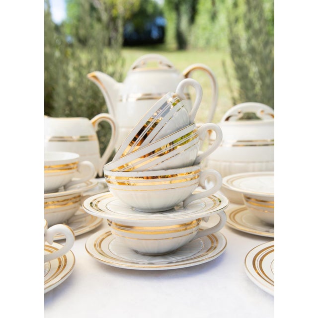 The service includes the following 25 pieces: 10 cups (9 cm diameter, 4 cm high) 12 saucers (13 cm diameter) Coffee pot:...