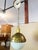 Lambert globe pendant light by Hudson Valley Lighting. A polished brass top fixture and a white glass shade make for a...