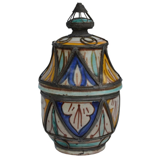 Antique handcrafted and glazed ceramic jar with lid. Features an intricately hand-painted Moorish pattern in a traditional...