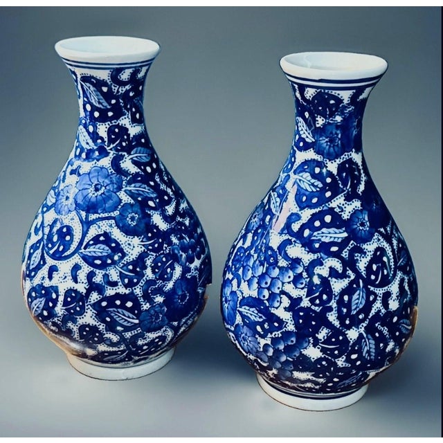 Vintage pair of Chinese decorative vases. Two matching ceramic baluster urns with painted detail, dating to the late 20th...